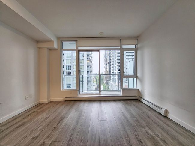 Unfurnished room featuring wood finished floors and baseboards | Image 5