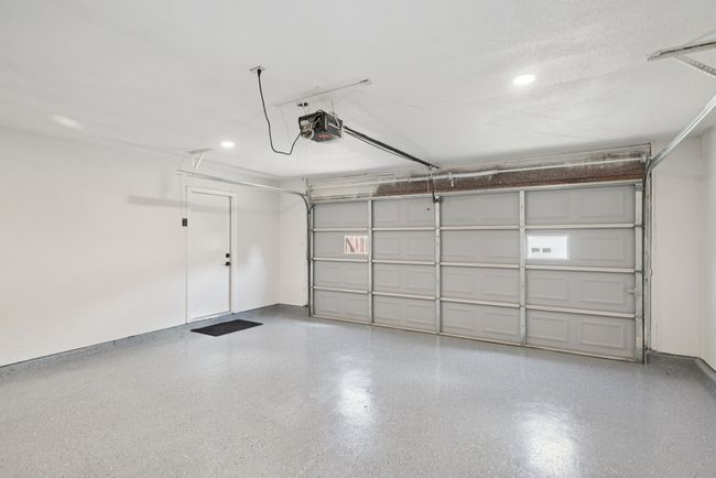 Garage featuring recessed lighting and a garage door opener | Image 37