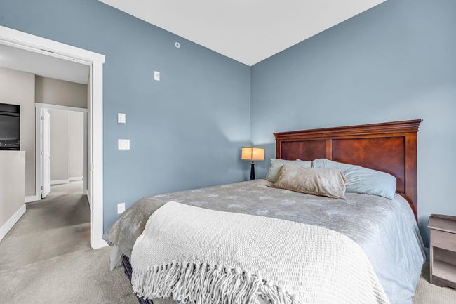 Bedroom with carpet floors and baseboards | Image 21