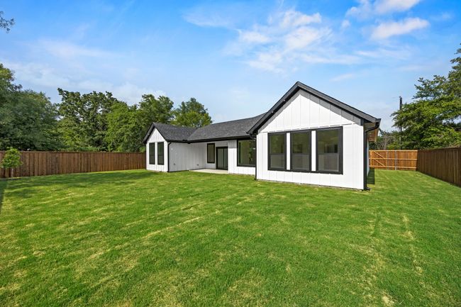 Back of property with board and batten siding | Image 33