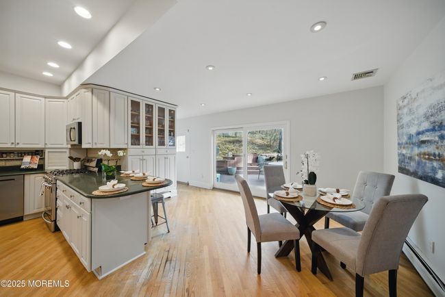 Eat in Kitchen with separate Dining, Coffee bar, SS appliances with sliders to LARGE deck with privacy and nature. | Image 13