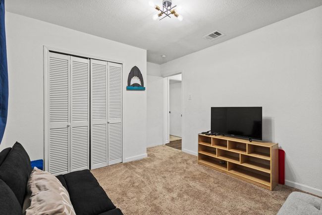 Living room featuring carpet flooring and baseboards | Image 24