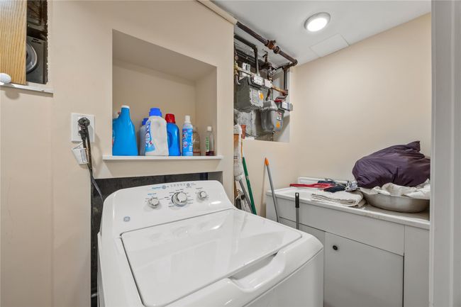 Laundry area with washer and clothes dryer | Image 34