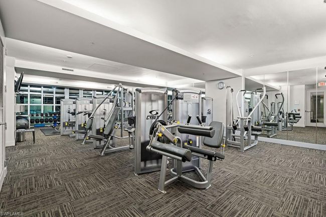 Exercise room featuring dark colored carpet | Image 34