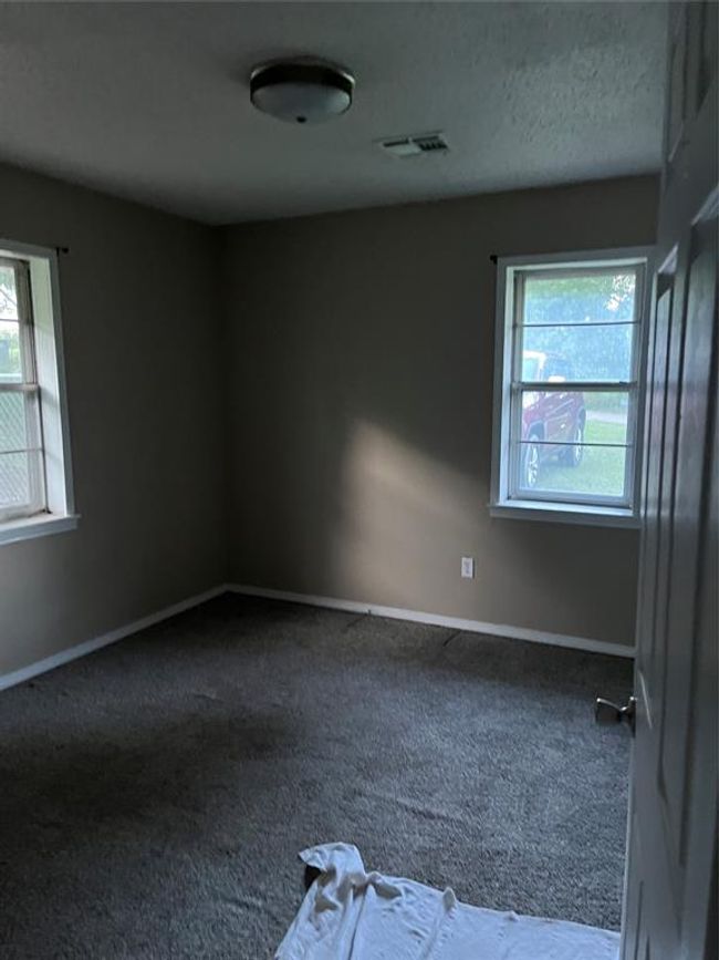 Carpeted spare room with baseboards | Image 18