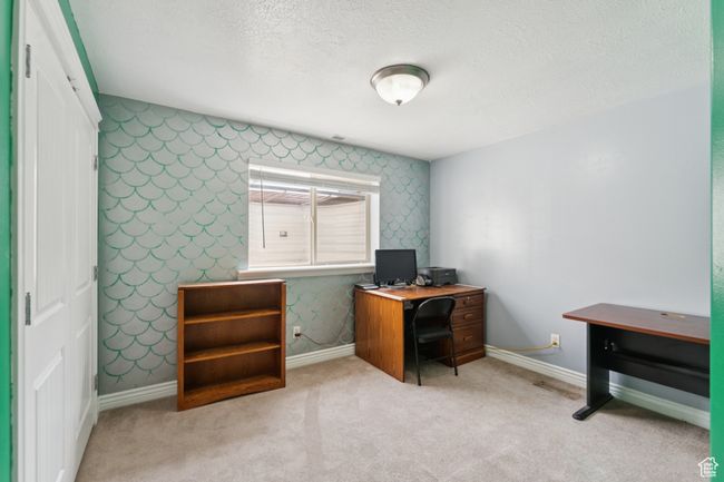 Home office with wallpapered walls, baseboards, a textured ceiling, and carpet | Image 30
