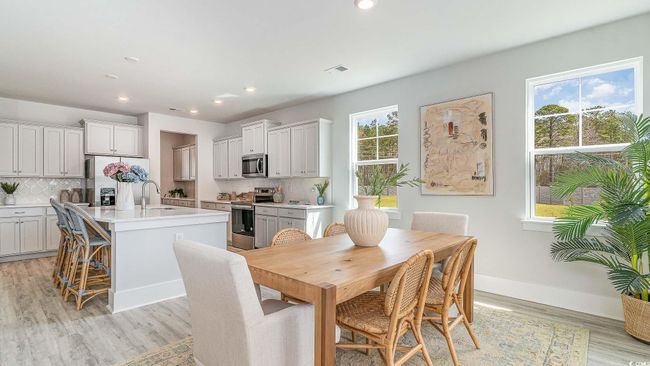 Dining area featuring recessed lighting, light wood-type flooring, and baseboards | Image 9