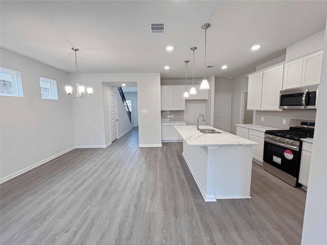 The Robin II- Dining Area into the Family Room. Home under construction. Sample floor plan photo used for illustrative purposes only. Upgrades, selections options, windows and colors may vary. | Image 4