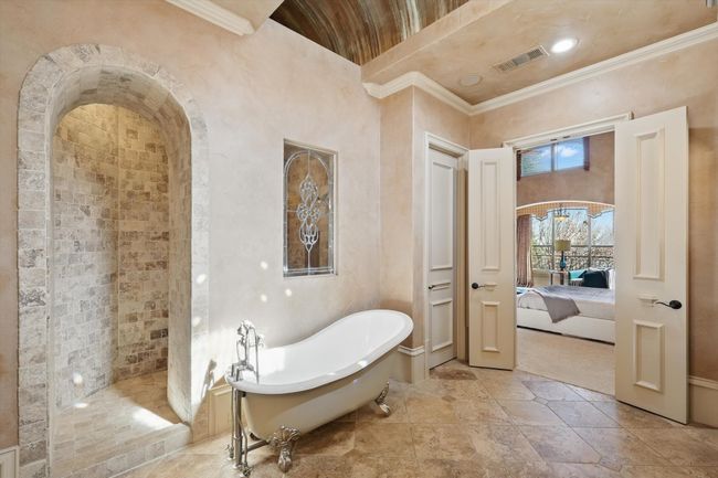 The primary shower is built for 2 and the bathroom has a beautiful decorative moonlight ceiling feature. | Image 22