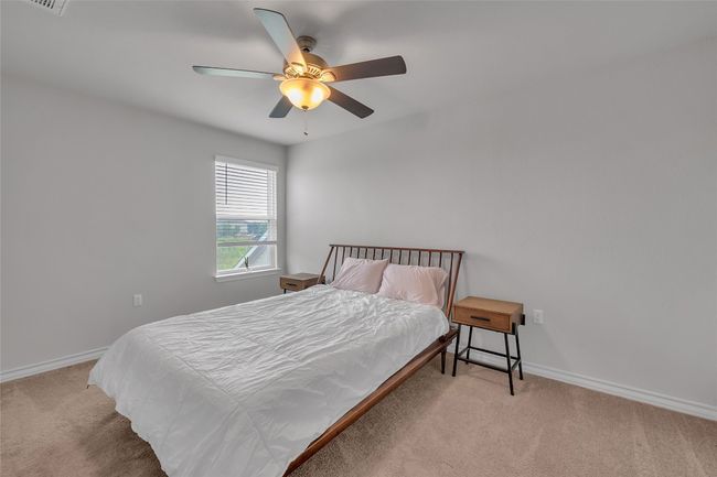 Carpeted bedroom with baseboards and ceiling fan | Image 17