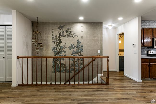 Corridor with wood finished floors, baseboards, and recessed lighting | Image 8