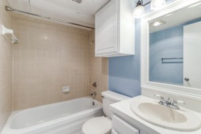 Full bath featuring vanity and shower / washtub combination | Image 15