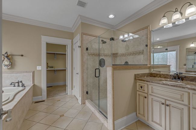 Primary Bath with double vanities, spa tub, huge shower, extra-large walk-in closet, and plenty of counter space. What's not to like! | Image 25