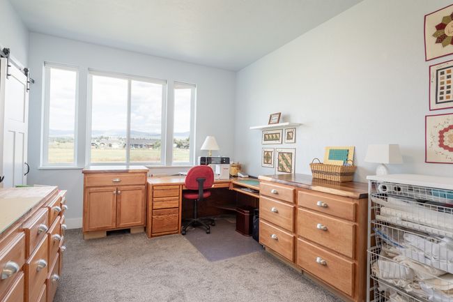 3rd bedrm being used as craft room. All cabinets and desk are excluded from sale. | Image 22