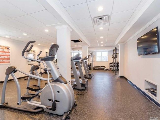 Workout area featuring a paneled ceiling, baseboards, recessed lighting, and crown molding | Image 31