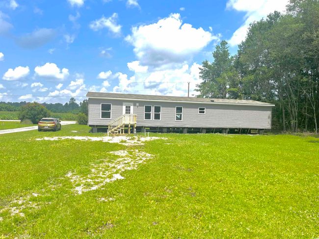 Rear view of property with a lawn | Image 6