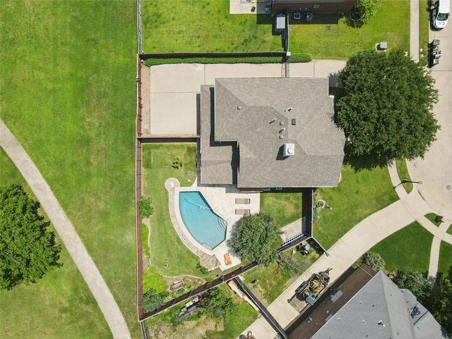 This amazing backyard backs up to a walking path & green space that provides so much privacy. | Image 5