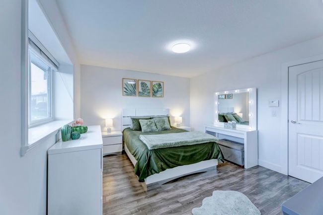 Bedroom featuring wood finished floors | Image 31