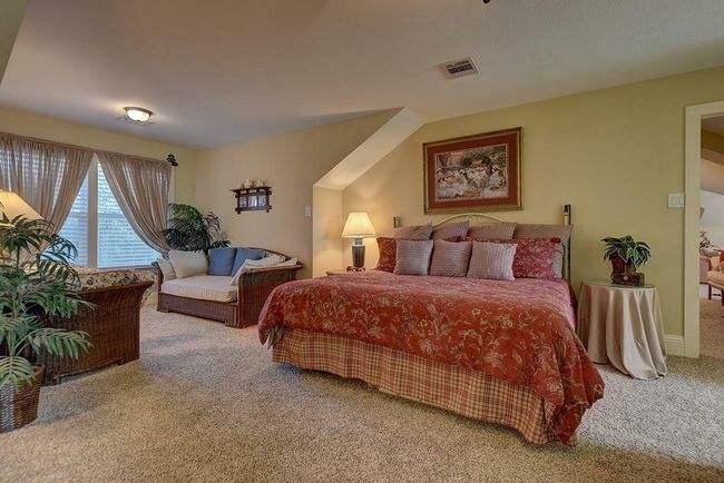 the other second floor bedroom with sitting area. There are two closets. | Image 40