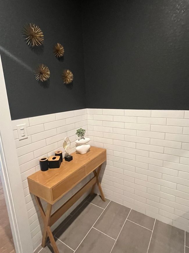 Detailed view of tile walls and a wainscoted wall | Image 16
