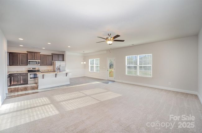 Wide angle shot of the Open Family Room off of the kitchen and breakfast areas. Un-Staged. | Image 6