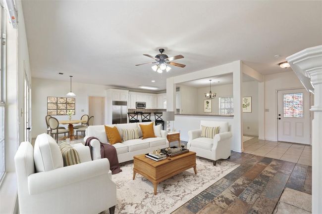 The living and dining areas have been virtually staged to show their potential | Image 10