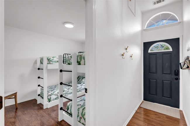 Foyer entrance featuring baseboards and wood finished floors | Image 8