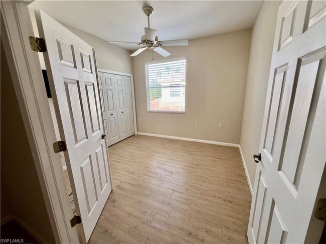 This room can be either an extra bedroom or a den. | Image 29