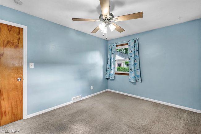 Carpeted empty room with crown molding | Image 16