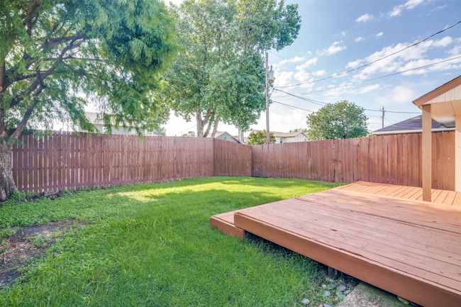Fenced backyard featuring a wooden deck | Image 25