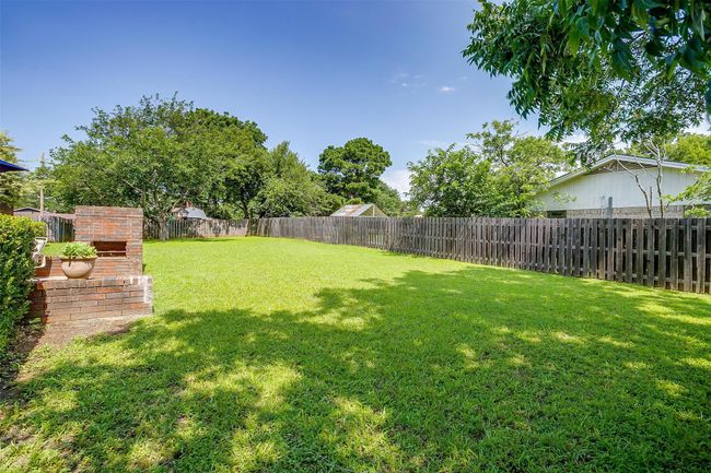 View of fenced backyard | Image 36