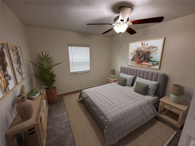 Bedroom featuring a ceiling fan and carpet floors | Image 4