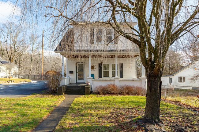View of front of house featuring covered porch and a front yard | Image 18