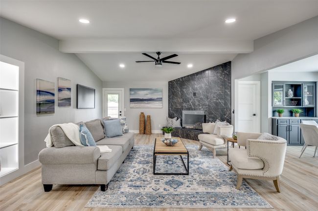 Living area featuring light wood-type flooring, ceiling fan, and recessed lighting | Image 5