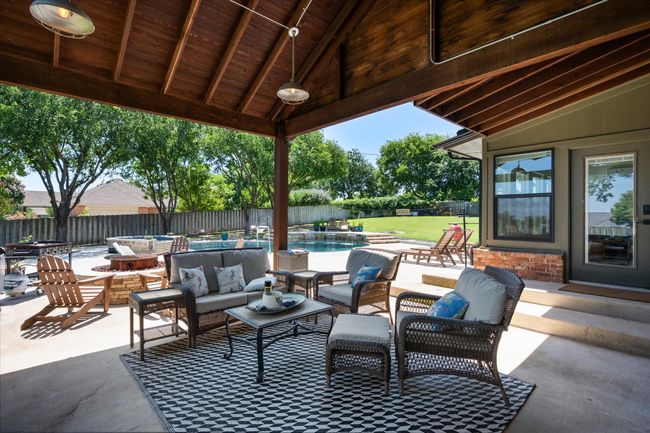 Fenced backyard with outdoor lounge area and a patio area | Image 23
