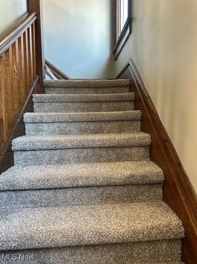 View of front staircase in entryway. | Image 14