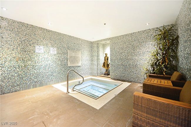 View of pool with an indoor in ground hot tub | Image 45