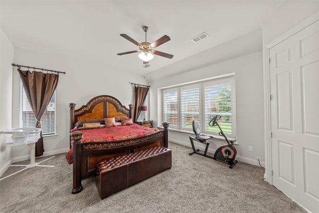 Carpeted bedroom featuring baseboards and a ceiling fan | Image 20