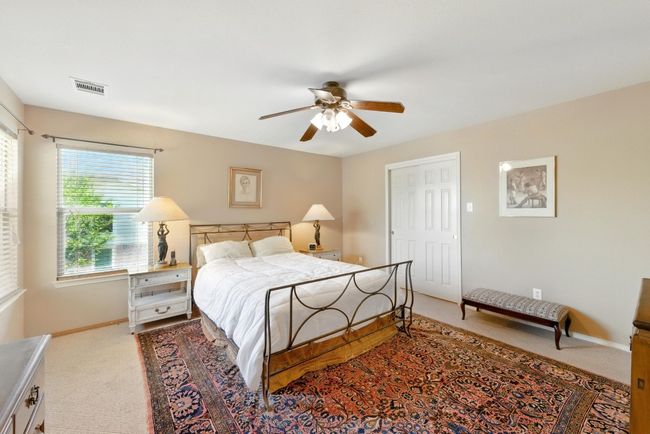 Bedroom featuring carpet, baseboards, and a ceiling fan | Image 19