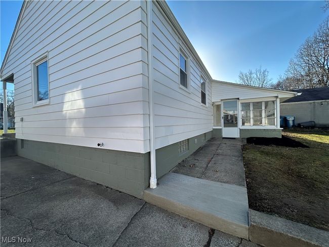 View of home's exterior with a sunroom | Image 29