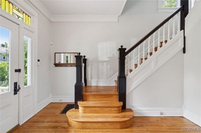 Foyer with crown molding, plenty of natural light, and wood-type flooring | Image 3