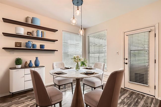 Dining room featuring dark wood-style floors and baseboards (virtual staging) | Image 7