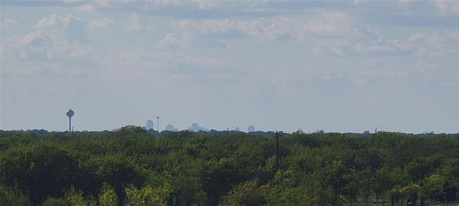 Looking west, one can see Dallas cityscape over the trees. | Image 13