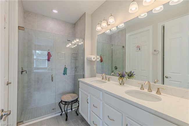 Full bathroom with a sink, a shower stall, and double vanity | Image 15