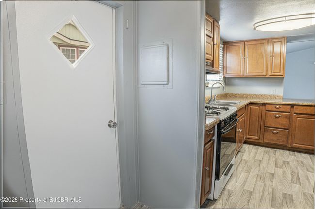 Back door looking into kitchen | Image 10