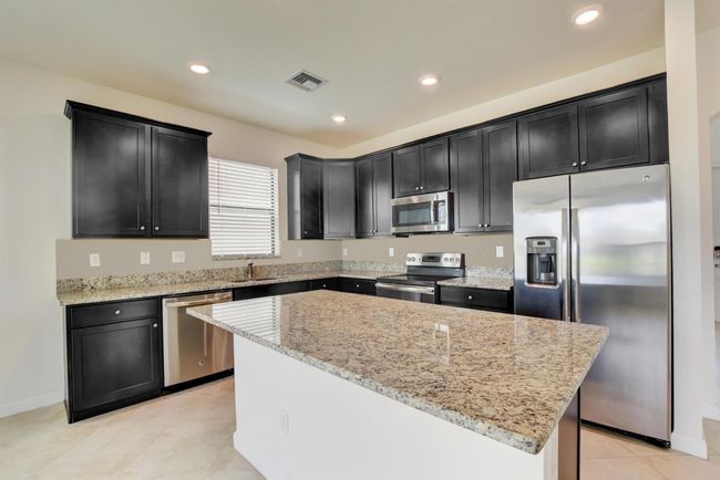 8885 Sea Chase Dr, House other with 4 bedrooms, 3 bathrooms and null parking in Lake Worth FL | Image 7