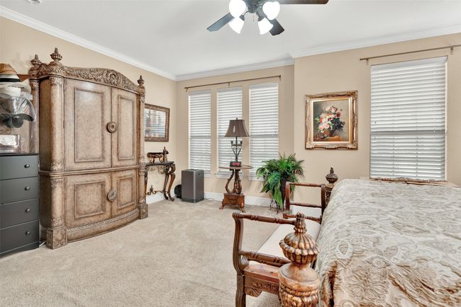 Plenty of windows highlight the primary suite, and provide a great space for a cozy and quiet reading nook, meditation space, or even yoga! | Image 17