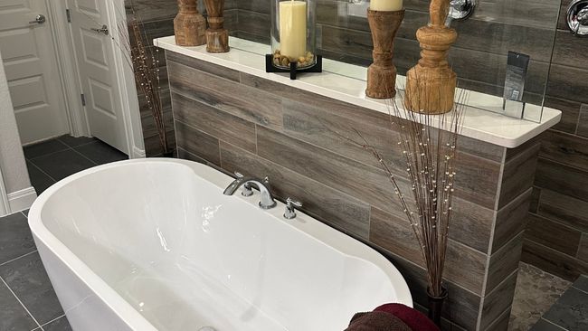Bathroom featuring a freestanding tub and tile patterned flooring | Image 8