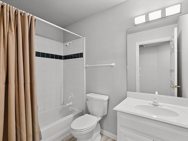 Bathroom with shower / bath combo with shower curtain and vanity | Image 28
