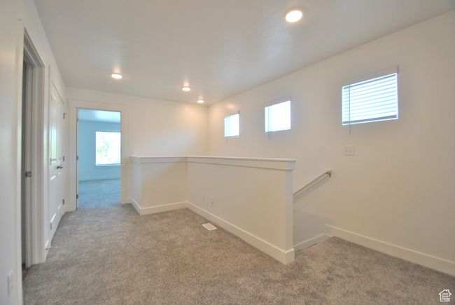 Hall with carpet flooring, an upstairs landing, healthy amount of natural light, and recessed lighting | Image 7